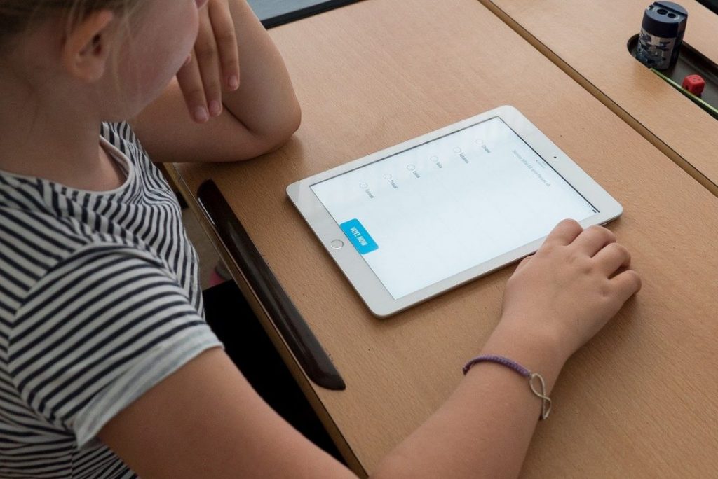 girl watching tablet