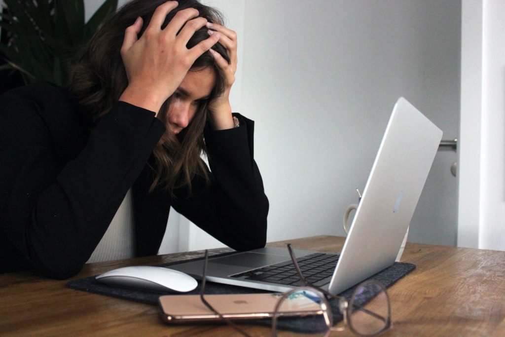 woman frustrated due to slow laptop