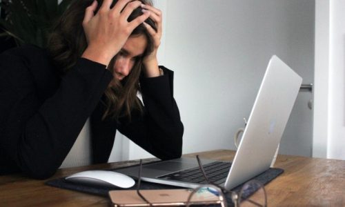 woman frustrated due to slow laptop